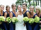 Bride Accompanied by Six Bridesmaids Wearing Royal Blue Gowns and Carrying Lime Green Hydrangeas
