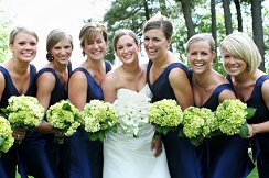 Bride Accompanied by Six Bridesmaids Wearing Royal Blue Gowns and Carrying Lime Green Hydrangeas
