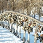 Locks adorn a snow-covered bridge as part of a traditional Russian wedding.