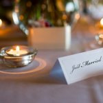 Festive wedding reception table with candles.