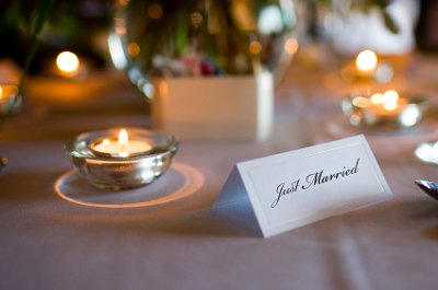 Festive wedding reception table with candles.