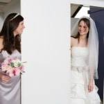 Bride and her maid of honor attend a final dress fitting.