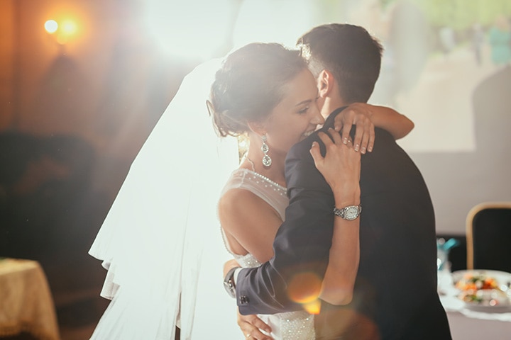 Beautiful bride and groom dancing their first dance at the wedding reception.